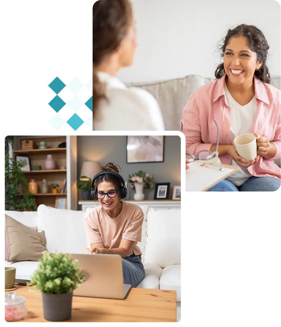 Two women chatting and using a laptop.